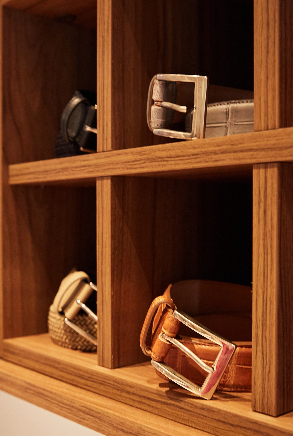 Hand-finished leather belts with polished buckles