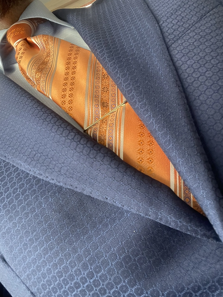 Close detail of a textured jacquard suit cloth